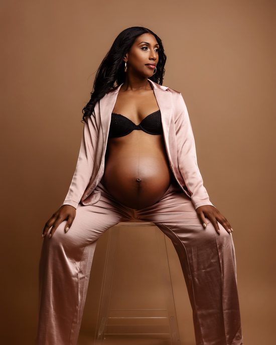 black maternity photoshoot with pink suit